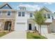 Charming townhouse with white siding, a one-car garage, and manicured front lawn at 43 Honeydew Way, Clayton, NC 27520