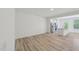Spacious living room with wood floors, stainless steel appliances, and abundant natural light at 43 Honeydew Way, Clayton, NC 27520