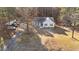 Aerial view of home highlighting the surrounding landscape and driveway at 5705 Katha Dr, Holly Springs, NC 27540