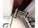 Attic access ladder coming down from the ceiling at 5705 Katha Dr, Holly Springs, NC 27540