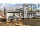 Rear view of house showcasing a light gray siding and a ramp at 5705 Katha Dr, Holly Springs, NC 27540