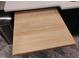 Pull-out cutting board in kitchen countertop with modern design elements and neutral color palette at 5705 Katha Dr, Holly Springs, NC 27540