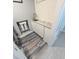 Laundry room features white cabinets, marble countertop and modern sink at 5705 Katha Dr, Holly Springs, NC 27540