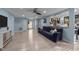 Open-concept living room with hardwood floors, modern decor, and a bright, airy atmosphere at 5705 Katha Dr, Holly Springs, NC 27540
