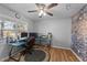 Dedicated home office space with a ceiling fan, ample desk space, and plenty of natural light at 5705 Katha Dr, Holly Springs, NC 27540