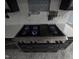 Close-up of a professional-grade stainless steel gas range with white countertops at 5705 Katha Dr, Holly Springs, NC 27540