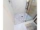 Modern shower featuring stylish tile design and sleek glass enclosure at 5705 Katha Dr, Holly Springs, NC 27540