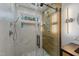 Updated shower with dual shower heads, bench, and modern finishes at 5705 Katha Dr, Holly Springs, NC 27540