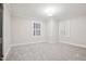 Simple bedroom with gray carpet and window shutters at 808 W Willowbrook Dr, Burlington, NC 27215