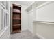 Walk-in closet with built-in shelving and hanging rods at 808 W Willowbrook Dr, Burlington, NC 27215