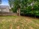 Spacious backyard enclosed by a wooden fence, offering privacy and space for outdoor enjoyment at 113 Crosswind Dr, Cary, NC 27513