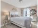 Airy bedroom with elegant decor, featuring soft lighting and a comfortable bed at 259 Whitley Ridge Dr, Clayton, NC 27527