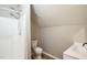 Bathroom featuring a walk-in shower, toilet, sink and wood-look flooring at 309 Monterey Ct, Benson, NC 27504