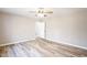 Empty bedroom with a ceiling fan and wood-look flooring throughout at 309 Monterey Ct, Benson, NC 27504