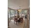 Bright dining room featuring hardwood floors, neutral walls, and a chandelier at 309 Monterey Ct, Benson, NC 27504