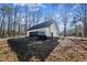 Exterior view of the back of the home showing the back deck and yard at 309 Monterey Ct, Benson, NC 27504