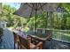 Back deck featuring an umbrella and a table and chairs at 340 Andrews Store Rd, Pittsboro, NC 27312