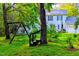 A spacious backyard featuring a swing set and lush greenery at 340 Andrews Store Rd, Pittsboro, NC 27312