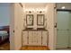 Bright bathroom with a double sink vanity, modern lighting and walk in shower at 340 Andrews Store Rd, Pittsboro, NC 27312