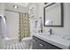 Bathroom featuring black and white accents with a shower and tub combination at 340 Andrews Store Rd, Pittsboro, NC 27312