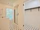 Bright bathroom features hexagon tile floor, shower with glass door and walk-in closet at 340 Andrews Store Rd, Pittsboro, NC 27312