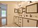 Bright bathroom features a double vanity, modern fixtures, and mosaic tile floors at 340 Andrews Store Rd, Pittsboro, NC 27312