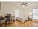 Bedroom with hardwood floors and natural light with a desk at 340 Andrews Store Rd, Pittsboro, NC 27312