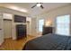 Cozy bedroom featuring a ceiling fan, hardwood floors, and abundant closet space at 340 Andrews Store Rd, Pittsboro, NC 27312