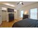 Inviting bedroom with hardwood floors, ceiling fan and ample natural light at 340 Andrews Store Rd, Pittsboro, NC 27312