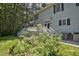 Deck with stairs, railing, and lush landscaping at 340 Andrews Store Rd, Pittsboro, NC 27312