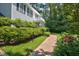 Landscaped front yard with brick walkway at 340 Andrews Store Rd, Pittsboro, NC 27312