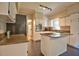 Bright kitchen with granite countertops, stainless steel oven and center island cooktop at 340 Andrews Store Rd, Pittsboro, NC 27312