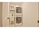 Laundry room featuring a stacked washer and dryer and a vanity with a sink at 340 Andrews Store Rd, Pittsboro, NC 27312