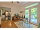 Inviting living room with hardwood floors, French doors, and a seamless transition to outdoor spaces at 340 Andrews Store Rd, Pittsboro, NC 27312