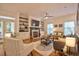 Cozy living room with a fireplace, built-in shelves, hardwood floors, and an inviting atmosphere at 340 Andrews Store Rd, Pittsboro, NC 27312