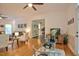 Open-concept living area with hardwood floors, modern decor, and seamless flow to the dining space at 340 Andrews Store Rd, Pittsboro, NC 27312