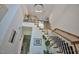 An impressive staircase with natural wood banister with carpet and modern lighting at 340 Andrews Store Rd, Pittsboro, NC 27312