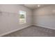 Walk-in closet featuring carpeted floors and ample shelving at 534 Glenkirk Pl # 110, Garner, NC 27529