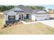 Charming home with a three-car garage, stone accents, and well-maintained landscaping at 534 Glenkirk Pl # 110, Garner, NC 27529