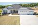 Charming home with a three-car garage, stone accents, and well-maintained landscaping at 534 Glenkirk Pl # 110, Garner, NC 27529