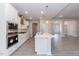Bright, open kitchen featuring stainless steel appliances, an island, and modern white cabinetry at 534 Glenkirk Pl # 110, Garner, NC 27529