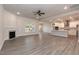 Open-concept living room featuring a fireplace and seamless flow into the kitchen at 534 Glenkirk Pl # 110, Garner, NC 27529