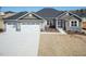 Beautiful single-Gathering home with a three-car garage and stone accents, complemented by a well-manicured front yard at 563 Glenkirk Pl # 104, Garner, NC 27529