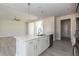 Open-concept kitchen with a large island, stainless steel appliances, and hardwood flooring at 563 Glenkirk Pl # 104, Garner, NC 27529