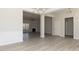 Open-concept living room with natural light, beautiful hardwood flooring, and elegant trim work at 563 Glenkirk Pl # 104, Garner, NC 27529