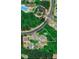 A high angle view shows the property nestled among trees with neighborhood amenities nearby at 101 Clardona Way, Holly Springs, NC 27540