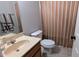 Bathroom features a vanity, toilet, and shower with neutral finishes at 101 Clardona Way, Holly Springs, NC 27540