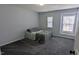 Bedroom features a comfortable bed, neutral decor, and plenty of natural light at 101 Clardona Way, Holly Springs, NC 27540