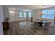Bright dining area with lots of windows, chandelier and hardwood floors at 101 Clardona Way, Holly Springs, NC 27540
