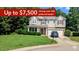 Charming two-story home with a manicured lawn, attached garage, and mature trees, offering a welcoming curb appeal at 101 Clardona Way, Holly Springs, NC 27540